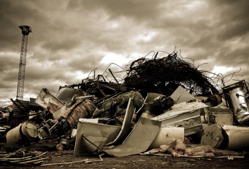 Workers sorting materials for recycling during a flat clearance in Wood Green